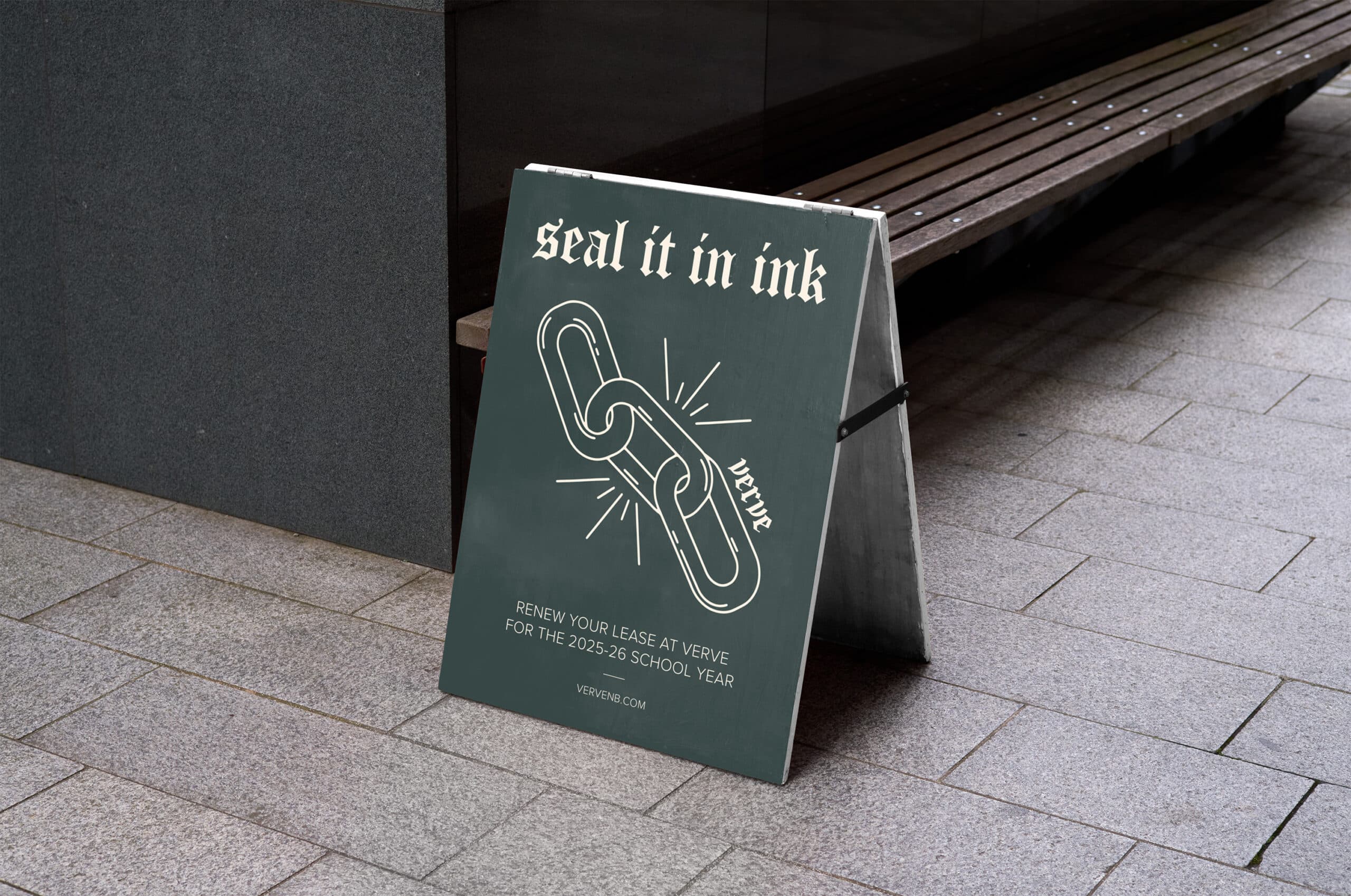 Sidewalk sign with an image of interlocking chains, displaying the text: "seal it in ink - renew your lease at Verge for the 2023-24 school year.