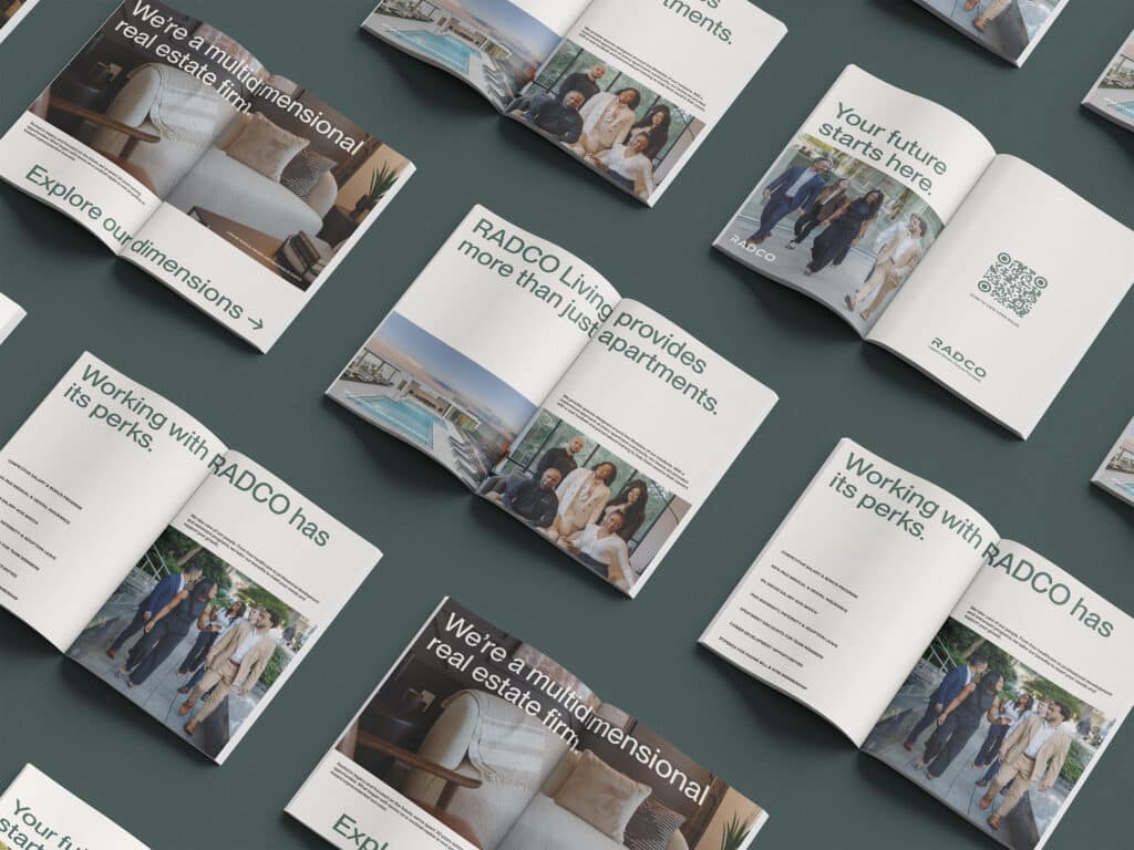 A layout of open brochures showcasing RADCO, featuring images of people, apartments, and text highlighting real estate services and lifestyle offerings.